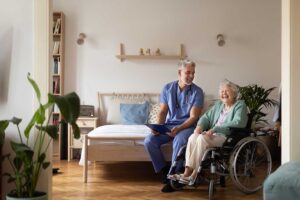 Older adult and family member review care options with a staff member in a bright assisted living apartment.